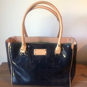 Kate Spade tote bag.  Navy blue patent leather with lime green silk inside.